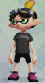 A male Inkling wearing the Black Pipe Tee.