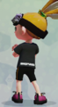 An Inkling boy showing the back of the Black Tee.