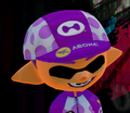Close-up of a male Inkling wearing the Cycle King Cap.