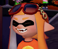 Closeup of a female Inkling wearing the Octoglasses.