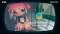 Agent 8 being awarded the Octarian mem cake upon completing the station.