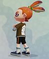 Another male Inkling wearing the Choco Layered LS, seen from the back.
