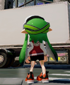 A female Inkling showing the back of the Paintball Mask.