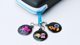 Bandai - Splatoon gear charm attached to zip.png