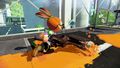 An Inkling Boy running with the Octobrush (behind)