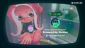 Agent 8 being awarded the Jelfonzo mem cake upon completing the station.