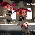 A male and female Octoling wearing the Enchanted Gear set in Splatoon 2