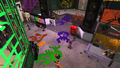 Squid, Octopus, and Salmonid decorations on the ground in Inkopolis Plaza