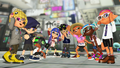 An Octoling (second from left) wearing the Blue Sailor Suit.