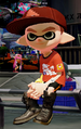 Another male Inkling wearing the Squidvader Cap.
