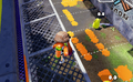 An Inkling standing on one of the grates in the Shooting Range.