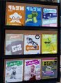 A set of magazines at Ancho-V Games, with a variation on the Octo Tee (left).