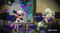 Animated GIF of the Squid Sisters waving at the player from their studio.
