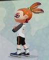 A male Inkling wearing the White Baseball LS, seen from the side.