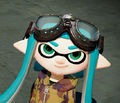 Closeup of a female Inkling wearing the Pilot Goggles.