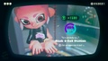 Agent 8 being awarded the Inkline mem cake upon completing the station.