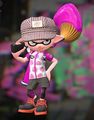 An Inkling wearing the Hickory Work Cap, posing with an Inkbrush