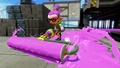 A front view of an Inkling running with a Splat Roller.