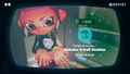 Agent 8 being awarded the Octopod mem cake upon completing the station.