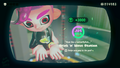 Agent 8 being awarded the Neon Sea Slugs mem cake upon completing the station
