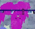 An Inkling hitting the unclimbable ledge surrounding the test range