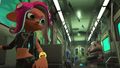 A female Octoling (playable) riding the Deepsea Metro.