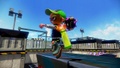 A male Inkling wearing the Green Rain Boots, signaling with a Slosher Deco.