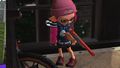 A female Inkling wearing the Knitted Hat, wielding the N-ZAP '89.