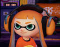Closeup of a female Inkling wearing the Noise Cancelers.
