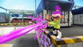 A male Inkling wearing the Olive Ski Jacket fires an Aerospray PG.