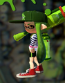Another female Inkling wearing the Squidvader Cap, posing with a Splat Roller.