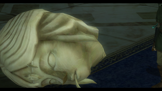 A screenshot of a severed Statue's head.