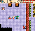 Link removing the mask of a Iron Mask with the Magnetic Glove in Oracle of Seasons
