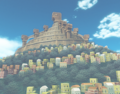 The mountain village in the background.