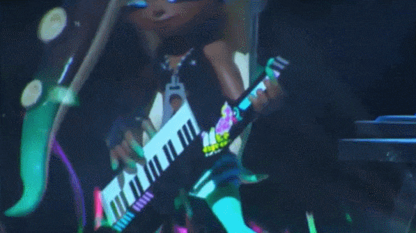 File:Marina playing the keytar.gif