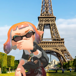 Inkling in sunglasses in front of the eiffel tower.png