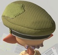 An Inkling with the Topknot hairstyle wearing the Cap of Legend. Unlike in Splatoon, the cap does not have a hole, so the Topknot no longer pops out of the hat.
