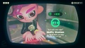 Agent 8 being awarded the Drizzler mem cake upon completing the station.