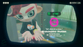 Agent 8 being awarded the Autobomb mem cake upon completing the station