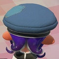 An Octoling girl wearing the Cap of Legend (Back view).