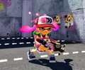 Another female Inkling wearing the Mawcasins, holding a Neo Splash-o-matic.