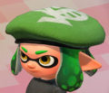 A closeup of an Inkling girl with green ink wearing the Annaki Beret.