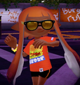 A female Inkling wearing the Tinted Shades.