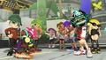 An Inkling wearing the Takoroka Rainbow Tie Dye in a promotion for returning gear during the Chill Season 2022.