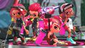 Promotional image of playable Octolings with Inklings in multiplayer.