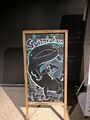 Chalkboard drawing featuring a Japanese giant salamander and Inkling