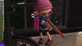 An Inkling girl wearing the Knitted Hat, wielding the N-ZAP '89.