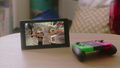 Nintendo Switch showing a promotional image from a Winter 2018-2019 Nintendo Switch commercial.
