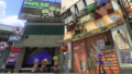 Grizzco exterior in Inkopolis plaza, shown in the Splatoon 3: Expansion Pass announcement trailer.