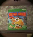 A poster in Ancho-V Games resembling the cover of Donkey Kong Country 3. In Splatoon 3 this easter egg is a collectible locker decoration.
